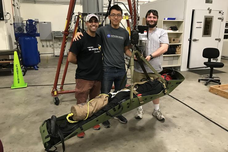 SALUS - Mahdi Al-Husseini, Anthony Chen, Joshua Barnett Computer science master's student Mahdi Al-Husseini, left, with the Stabilizing Aerial Loads Utility System he created with Stan