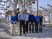 The TESLA (Tough and Ecological Supercritical Line Breaker for AC) team in front of high-voltage circuit breakers. The TESLA (Tough and Ecological Supercritical Line Breaker for AC) team in front of high-voltage circuit breakers.