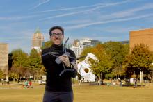 Tarek-Rakha-on-campus.jpeg Tarek Rakha on the Georgia Tech campus holding a drone in his arms.